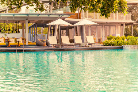 chair pool around swimming pool in hotel resort - holidays and vacations conceptのeditorial素材