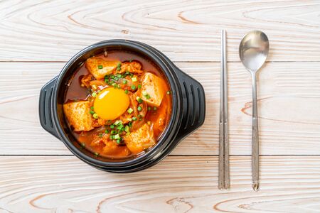 âKimchi Jjigaeâ or Kimchi Soup with Tofu and Egg or Korean Kimchi Stew  - Korean Food Traditional Styleの写真素材