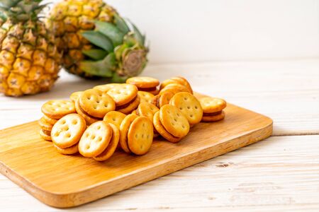 biscuits with pineapple jam on wood backgroundの写真素材