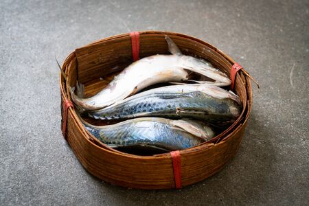steamed mackerel fish in bamboo basket
