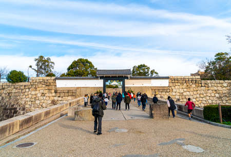 Osaka, Japan - Jan 11 2020 - Tourists walking around the Osaka Castle in a beautiful sky day in Osaka, Japan.のeditorial素材