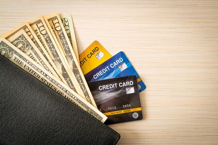 wallet with money and credit card - Economy and finance conceptの写真素材