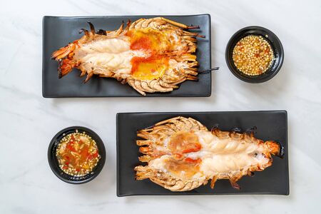 Grilled Fresh Giant River Prawn with Spicy Seafood Dipping Sauceの写真素材