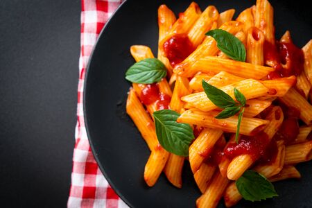 Penne pasta in tomato sauce - Italian food styleの写真素材