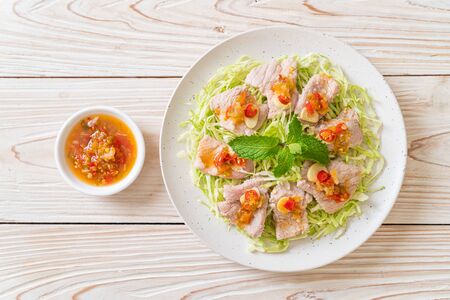Spicy Pork Salad or Boiled Pork with Lime Garlic and Chili Sauceの写真素材