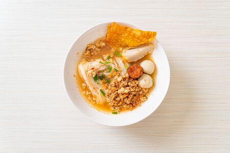spicy noodles with fish ball and minced pork (Tom Yum Noodles) - Asian food styleの写真素材