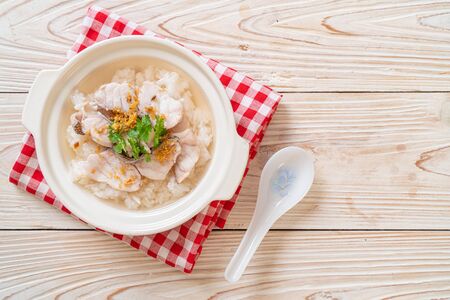 porridge or boiled rice soup with fish bowlの写真素材