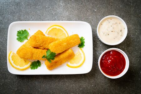 fried fish finger stick or french fries fish with sauceの写真素材