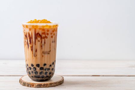 Taiwan milk tea with bubble on wood tableの写真素材