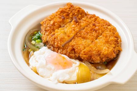 Japanese fried pork cutlet (katsudon) with onion soup and egg - Asian food styleの写真素材