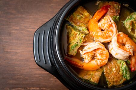 Sour soup made of Tamarind Paste with Shrimps and Vegetable Omelet - Asian food styleの写真素材