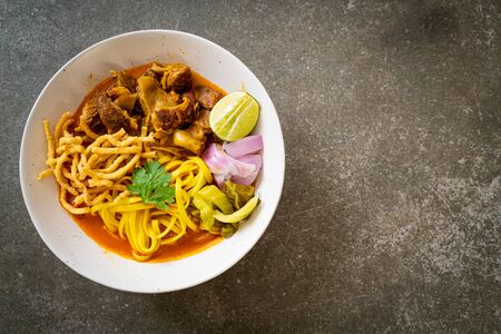Northern Thai noodle curry soup with braised pork - Thai food styleの写真素材
