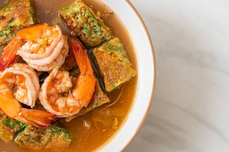 Sour soup made of Tamarind Paste with Shrimps and Vegetable Omelet - Asian food styleの写真素材