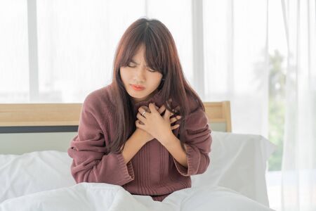beautiful Asian women Heart disease on bedの写真素材