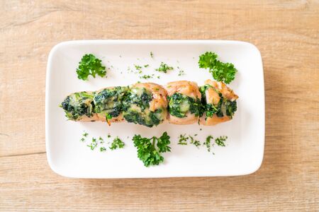Chicken breasts stuffed with spinach and cheese on plateの写真素材