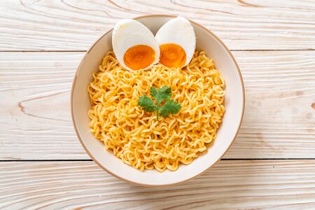 instant noodles bowl with salt eggの写真素材