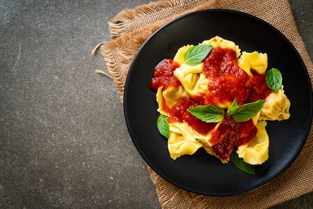 Italian tortellini pasta with tomato sauce - Italian food styleの写真素材