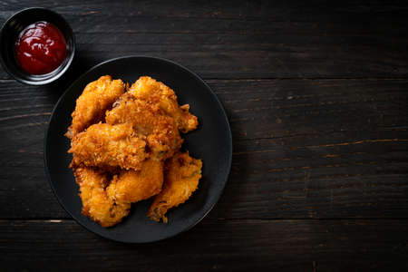 fried chicken wings with ketchup - unhealthy foodの写真素材