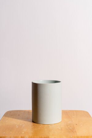 empty and beautiful clay flower pot on wood tableの写真素材