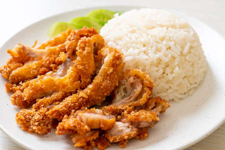 Hainanese chicken rice with fried chicken or rice steamed chicken soup with fried chicken - Asian food styleの写真素材