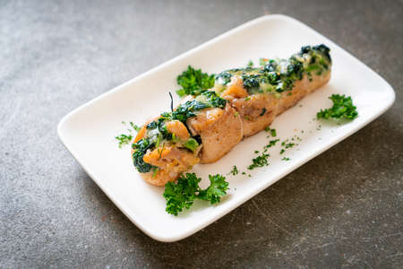 Chicken breasts stuffed with spinach and cheese on plateの写真素材