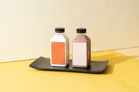 almond milk and almond chocolate milk bottleの写真素材