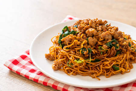 stir-fried instant noodles with Thai basil and minced pork - Asian food styleの写真素材