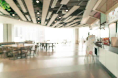 abstract blur food court in shopping mall for background