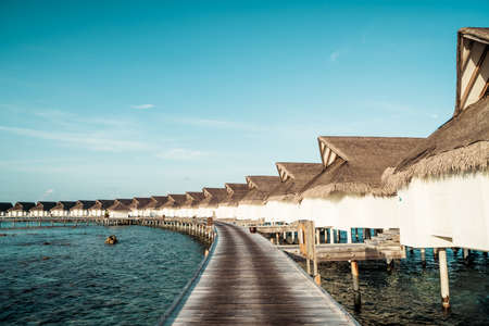 Beautiful tropical Maldives resort hotel and island with beach and sea  - boost up color processing styleのeditorial素材