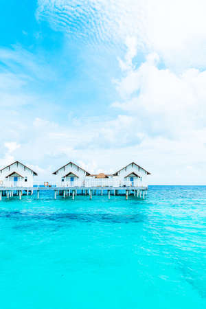Beautiful tropical Maldives resort hotel and island with beach and sea  - boost up color processing styleのeditorial素材