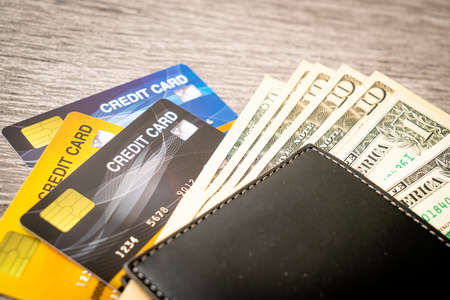 wallet with money and credit card - Economy and finance concept