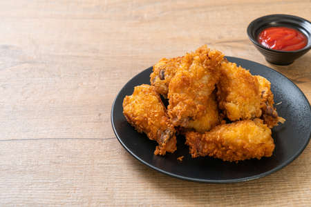 fried chicken wings with ketchup - unhealthy foodの写真素材