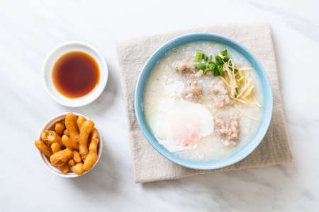 congee with minced pork in bowl - Asian breakfast style