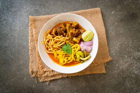 Northern Thai noodle curry soup with braised pork - Thai food styleの写真素材