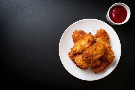 fried chicken wings with ketchup - unhealthy foodの写真素材