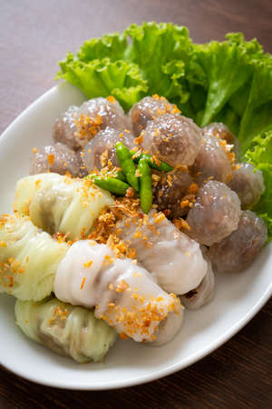 The transparent balls are called Saku Sai Moo or Steamed Tapioca Dumplings Ball with Pork Filling and ( Kow Griep Pag Mor)Pork Steamed Rice Parcels or  Steamed Rice-Skin Dumplingsの写真素材