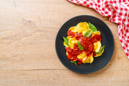Ravioli with tomato sauce and basil - Italian food styleの写真素材