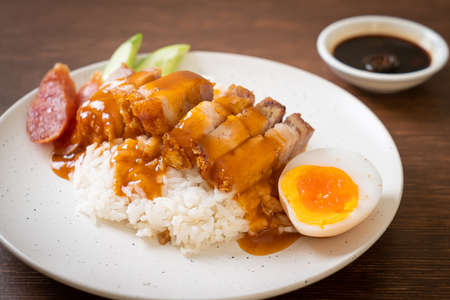 crispy belly pork on rice with barbecue red sauceの写真素材