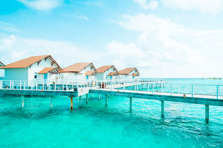 Beautiful tropical Maldives resort hotel and island with beach and sea  - boost up color processing styleのeditorial素材