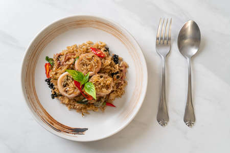 Homemade Basil and Spicy Herb Fried Rice with Squid or Octopus - Asian food style