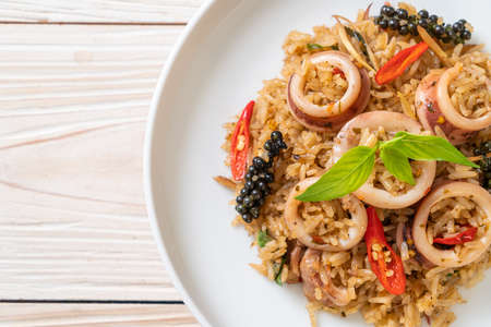 Homemade Basil and Spicy Herb Fried Rice with Squid or Octopus - Asian food styleの写真素材