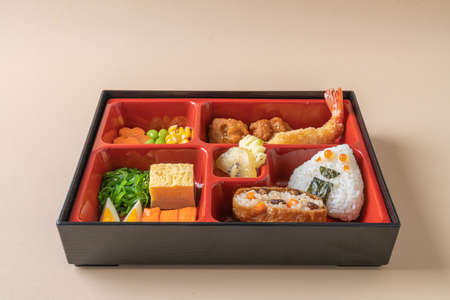 (inari sushi) sushi rice wrapped in dried tofu with fried shrimp and fried chicken in bento set -...