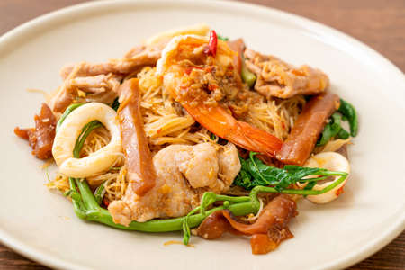 Stir-fried rice vermicelli and water mimosa with mix meat - Asian food styleの写真素材