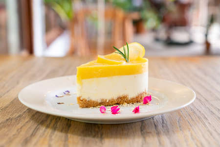 lemon cheese cake on plate in cafe and restaurant