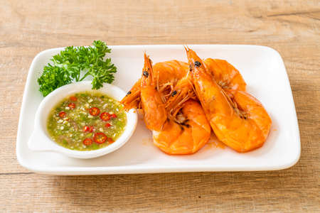baked salted shrimps or prawns with seafood spicy sauce - seafood styleの写真素材