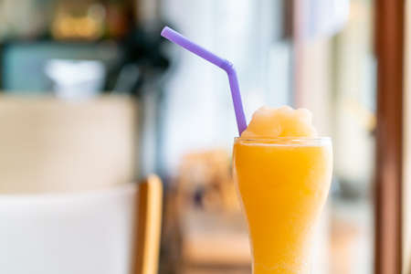 orange juice blend smoothie glass in cafe restaurant