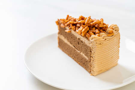 homemade coffee almonds cake on white plateの写真素材
