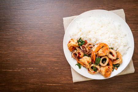 rice and stir-fried seafood (shrimps and squid) with Thai basil - Asian food styleの写真素材
