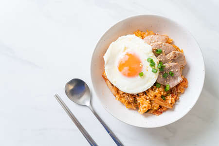 Kimchi fried rice with fried egg and pork - Korean food styleの写真素材