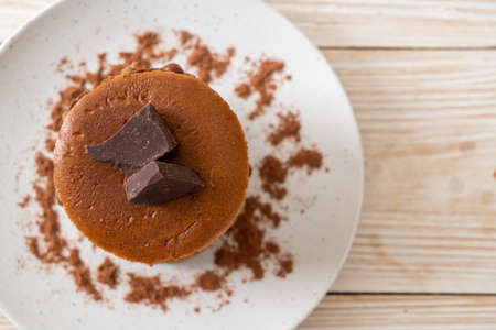 chocolate pancake stack with chocolate powder